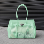 Sac à main Jelly Firkin Mint - sac tendance en TPU transparent effet gelée vert menthe, fermoir cadenas et anses surpiquées, style bowling chic